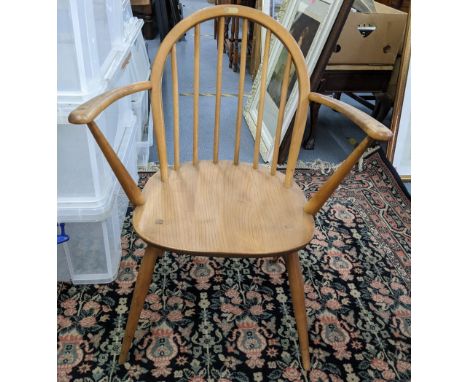 A mid 20th century Ercol Windsor elm and beech hoop back armchairLocation: 