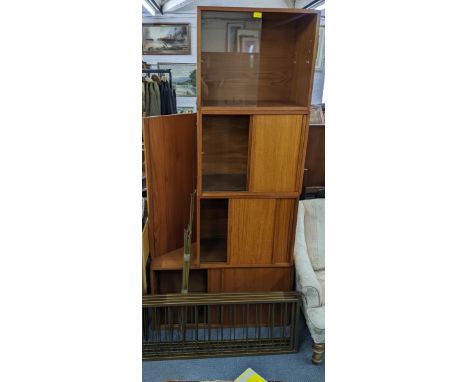 A mid 20th century Staples Ladderax system consisting of  five teak cabinets, one large shelf, four shorter shelves, twenty r