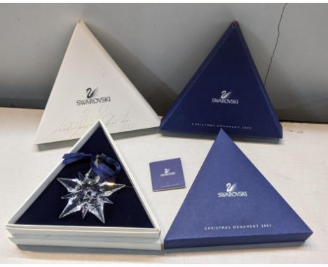 Four boxed Swarovski Christmas ornaments, 2001,2001, 2002 and 2003Location: 