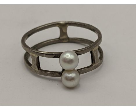 A pearl and white metal ring, the shank stamped 18ct, 3g Location:CAB 5 