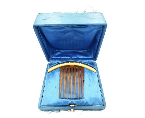 An antique cased French 18ct yellow gold pearl set hair comb. The gold arched top with a brushed effect, studded with sevente