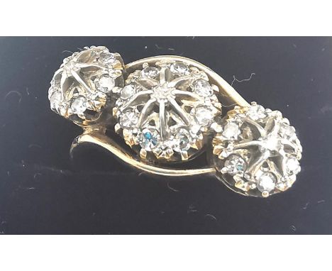 A Victorian 18ct yellow gold and old cut diamond triple cluster crossover ring, set with twenty three round old cut diamonds 