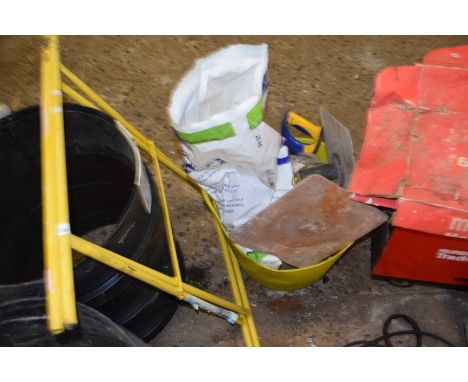 Metal stand together with a bucket of various plastering tools, ironmongery etc