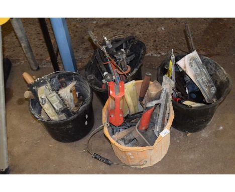 Four buckets of various tools