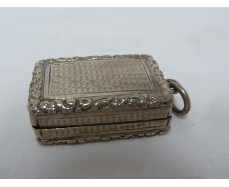 A Georgian silver snuff box, engine turned within chased rose spray border, suspension loop to one end, gilded interior, Birm