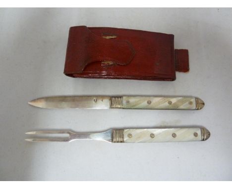 A travelling Georgian silver and mother of pearl knife and fork,set in Morocco leather case, the two tine fork and knife blad