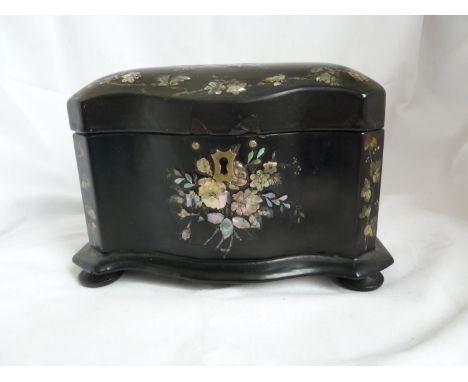 A Victorian papier mache tea caddy, of bombe outline, inlaid with summer flower bouquets composed of nacreous shells and hand