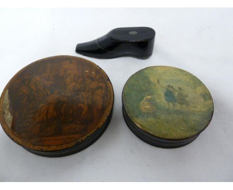 A papier mache snuff box, in the form of a shoe; and two papier mache snuff boxes, circular, one with applied paper printed t
