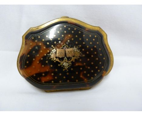 A tortoiseshell and pique work coin case, decorated with stars about a central motif of two reserves held aloft by flowering 