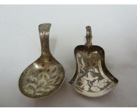 A Georgian silver caddy spoon, of small size the bowl decorated with wriggle work leafy fronds, a star of David to the handle
