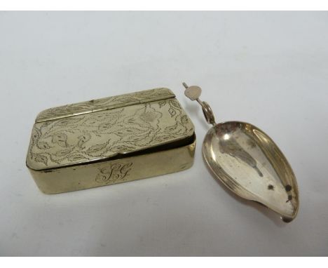 A white metal snuff box with hinged cover and pseudo hallmarks; and a white metal caddy spoon of leaf form, unmarked, 8.3cm m