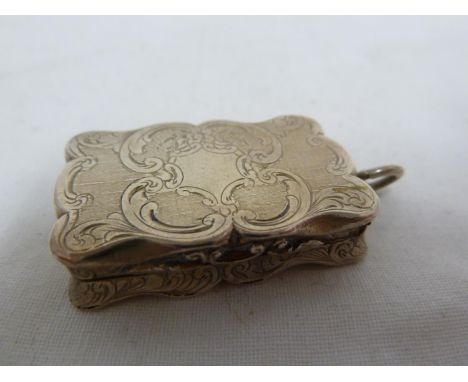 A Victorian silver vinaigrette, of rectangular form with 'C'scroll rim enclosing a posy of summer flowers on an engine turned