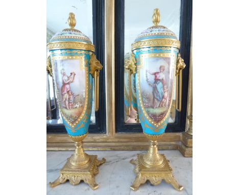 A pair of Sevres style ormolu and French porcelain vases and covers, decorated with vignettes of young maidens with harp and 