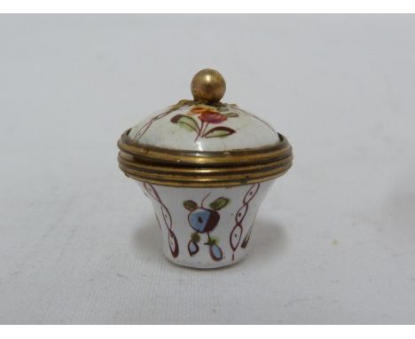 A miniature Screw top Bilston enamel patch box, of squat vase form, enamelled with polychrome florets within rope twist compa