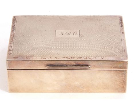 Silver cigarette box, the engine turned hinged lid with central initialled and engraved cartouche, wood lined, Birmingham 196