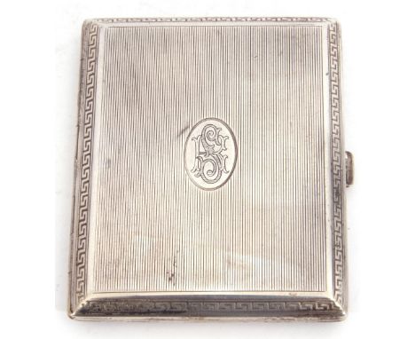 Continental white metal cigarette case of rectangular hinged form, engine turned with linear decoration, oval cartouche with 