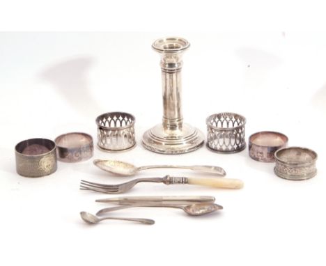 Mixed Lot: single silver dwarf candlestick, Birmingham 1901 (loaded), five silver serviette rings, silver cased long "lead" p