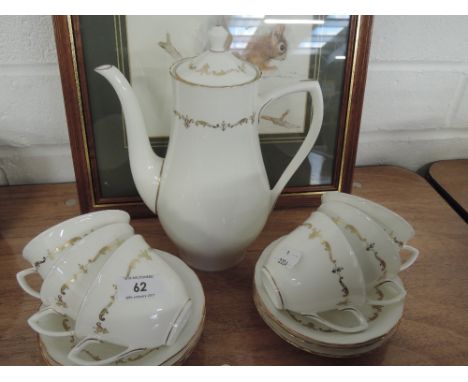 A Royal Worcester cream and gilt part coffee set