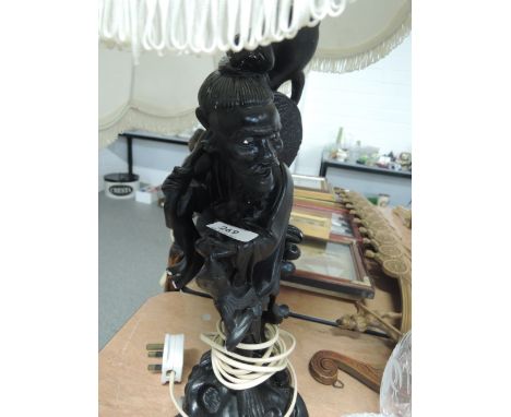 An oriental figure tabe lamp and shade