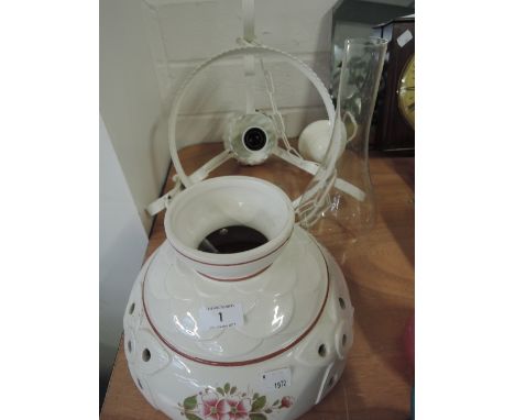 A ceramic light fitting with chimney