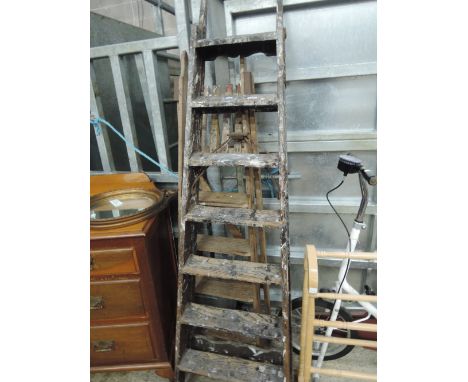 Two sets of vintage wooden step ladders