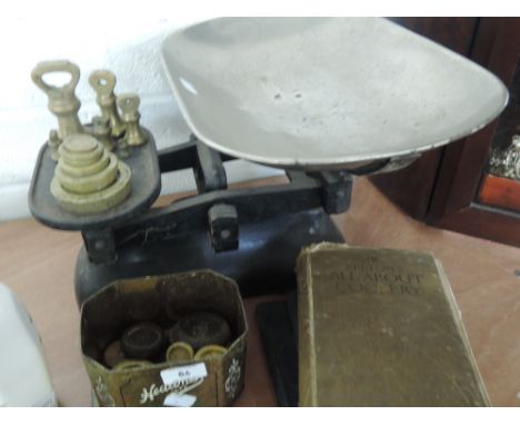 A set of vintage scales and weights and three early 20th century cookery books