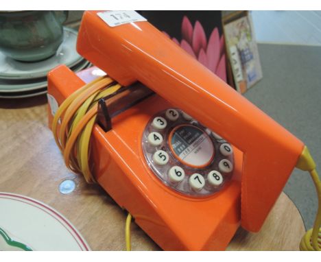 A vintage orange telephone