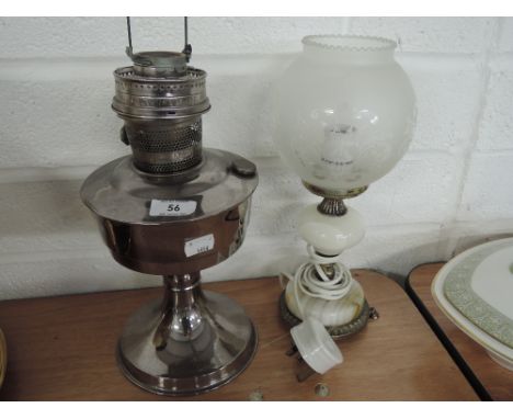 An oil lamp and onyx table lamp with glass shade