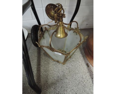 A brass and glass light fitting