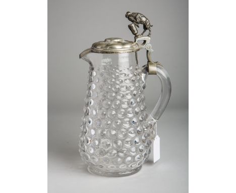 Kanne (wohl um 1900), klares Glas, Noppenoptik, Zinndeckel m. Ziegenbockfigur, H. ca. 30cm.