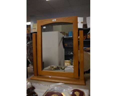 A modern oak rectangular dressing table mirror, measuring 54cm x 62cm overall