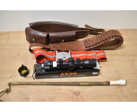 A 4X28 air rifle scope, two cartridge belts, a riding crop with integrated compass to end of handle and two belts, including 
