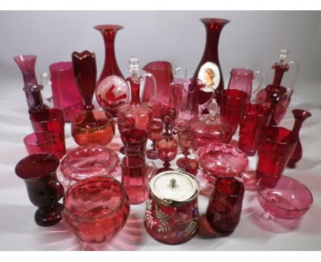 CRANBERRY &amp; RUBY GLASS COLLECTION OF JUGS, decanters, bowls, vases and drinking glassware, 30 plus pieces (some damages)