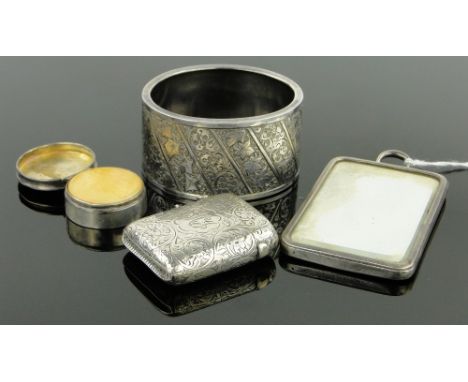 Group of silver items,
comprising  a silver backed pocket mirror, engraved vesta case, rouge pot and bangle, (4).