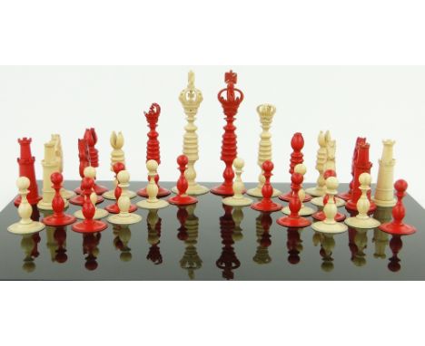 A 19th century red and white stained ivory chess set,
on turned circular bases, king height 5", some damaged pieces.