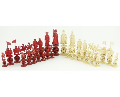 A 19th century Chinese carved red and white stained ivory chess set,
the figures having relief carved ivory robes, all raised