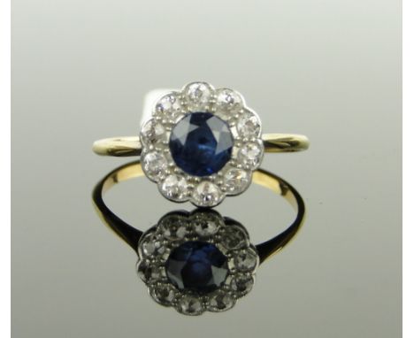 18ct gold sapphire and diamond cluster ring,
setting height 11mm, size R.