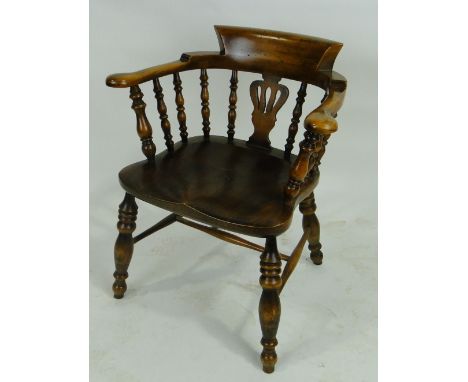 A reproduction smoker's bow armchair.