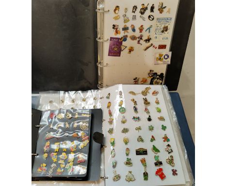 A collection of enamel lapel buttons in albums 