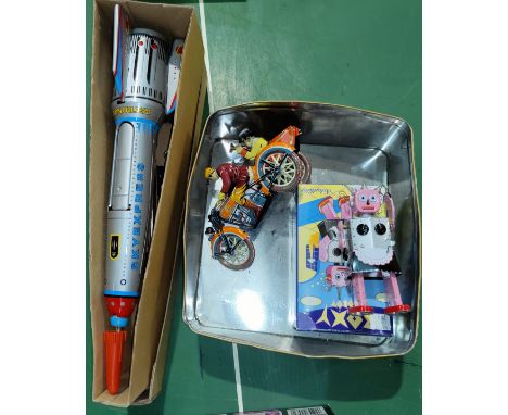 A Schulling tinplate robot, a tinplate wind up rocket and motorbike including sidecar 