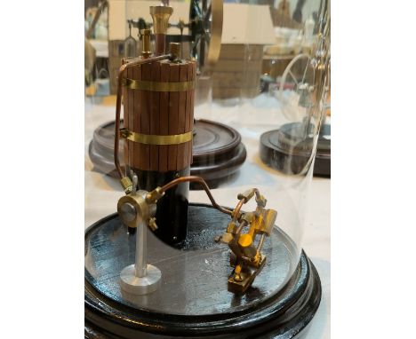 A scratch built steam powered engine under glass dome - in form of wooden barrel 