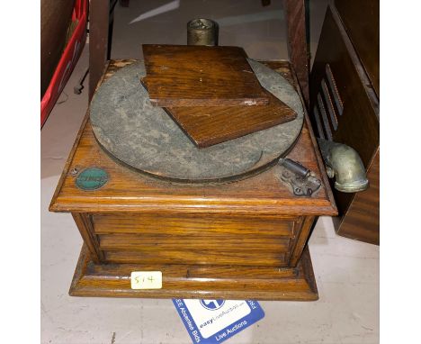 An oak cased The Cinch record player 