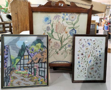 An Arts &amp; Crafts style mahogany fire screen with embroidered panel; 2 embroidered pictures 