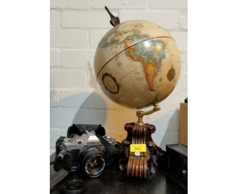 A Terrestrial Globe on wooden stand; a Canon SLR camera; a Panasonic Luminex camera. Condition report:- Globe made in the las