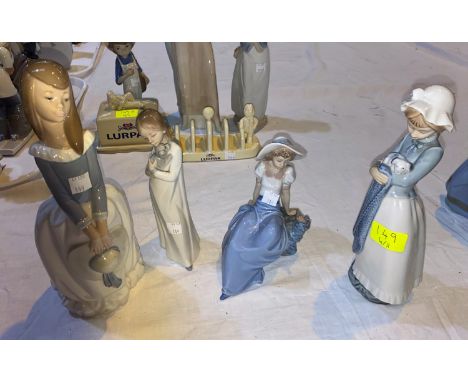 Four Nao figures of girls 
