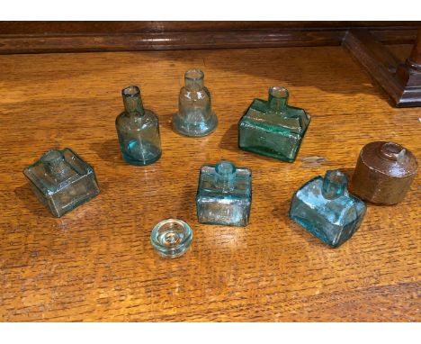 Six vintage glass ink pots of various shapes and a pot inkwell 