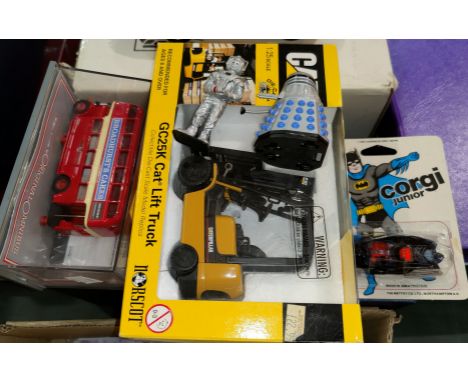 An original boxed CAT.GL25K carlift truck; a Corgi Junior batmobile originally boxed; an originally boxed London bus; Dalek f