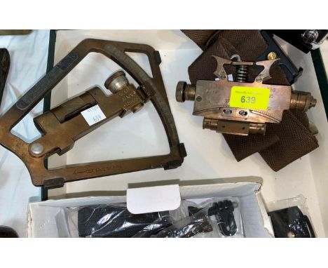 Two brass dinometers; a military belt; a modern digital camera; various RAF items 