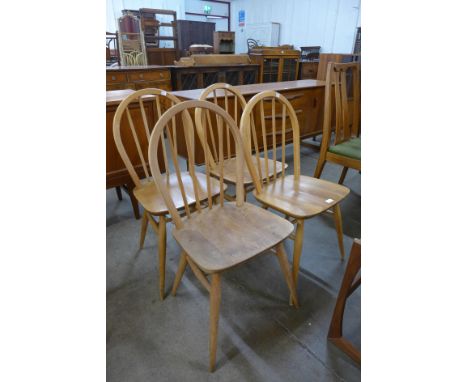 A set of four Ercol Blonde elm and beech Windsor chairs 