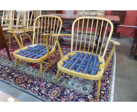 A pair of Ercol Blonde beech Windsor armchairs 